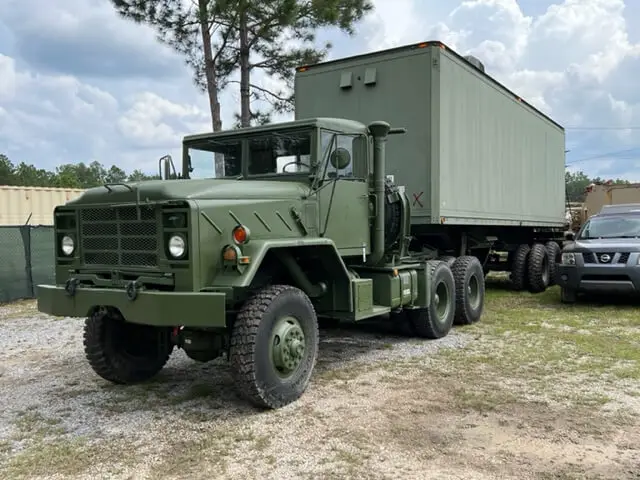 Six-wheel truck with a box shelter, side view